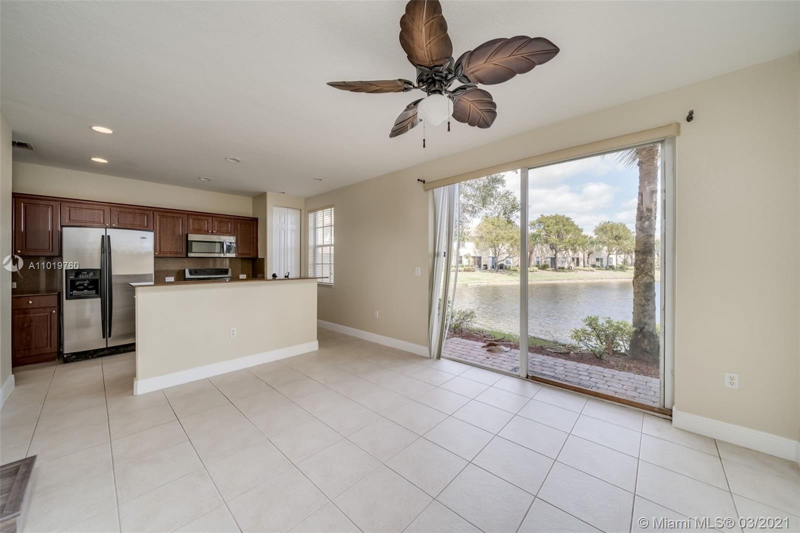 8437 Southwest 29th Street, Unit 102 Miramar, FL 33025 - Photo 11 of 29 a view of a kitchen with microwave and refrigerator