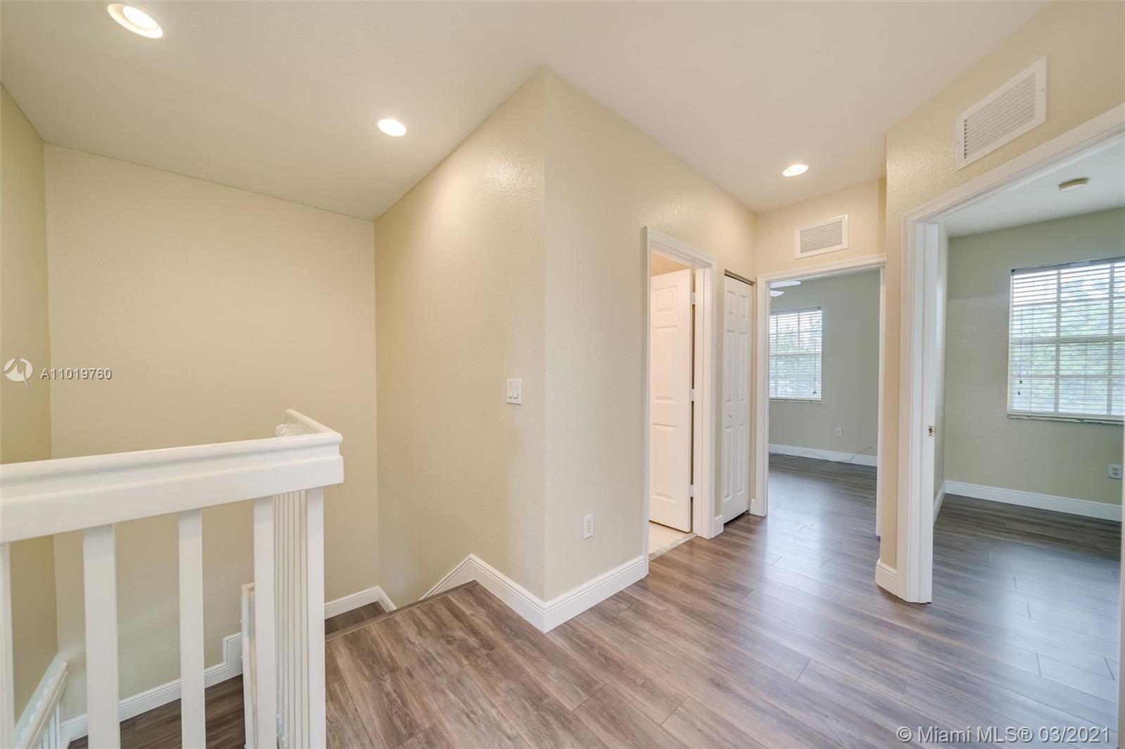 8437 Southwest 29th Street, Unit 102 Miramar, FL 33025 - Photo 20 of 29 a view of entryway with wooden floor
