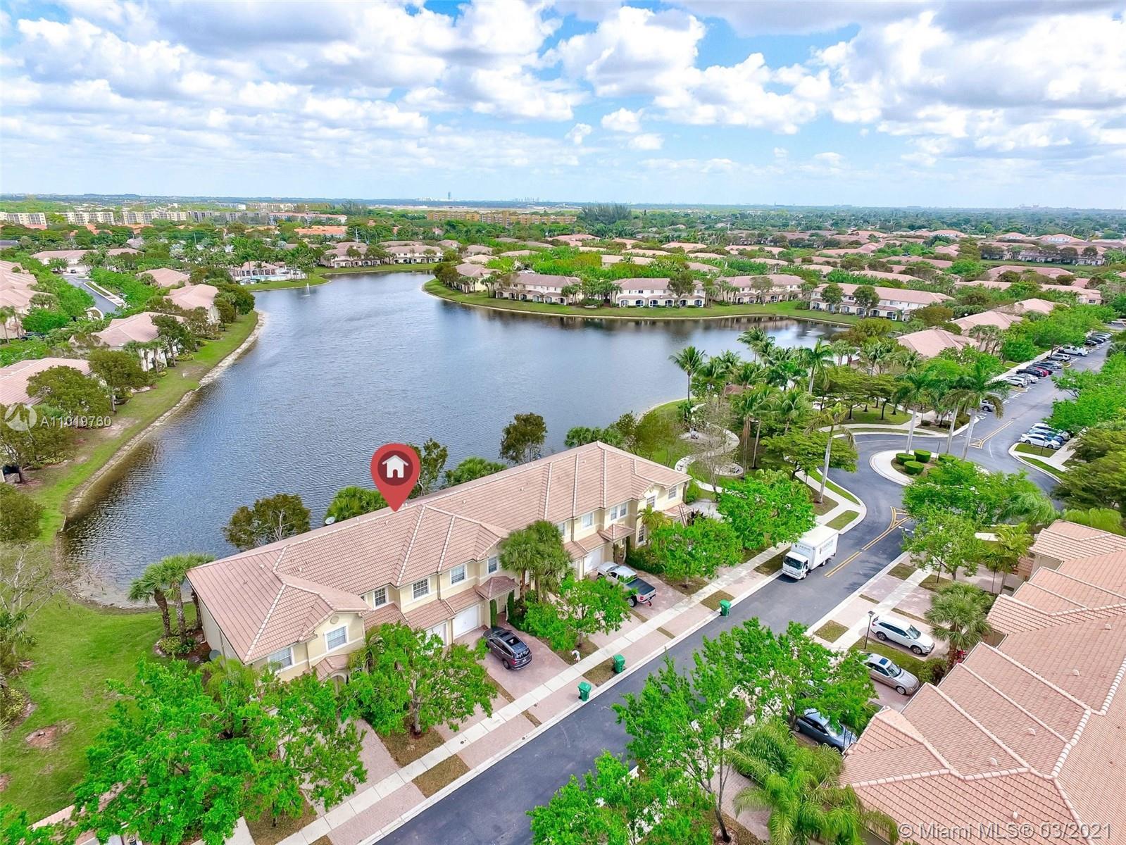 8437 Southwest 29th Street, Unit 102 Miramar, FL 33025 - Photo 3 of 29 an aerial view of a house with a garden and lake view