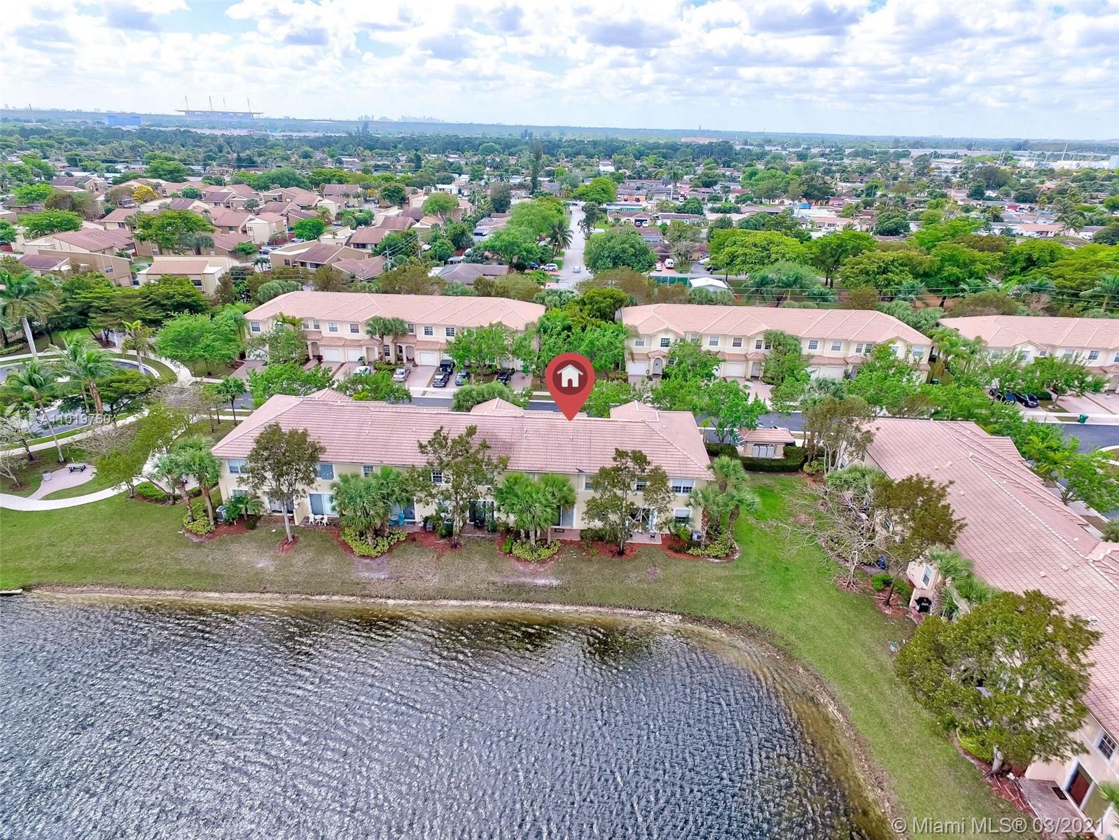 8437 Southwest 29th Street, Unit 102 Miramar, FL 33025 - Photo 4 of 29 an aerial view of lake and residential houses with outdoor space