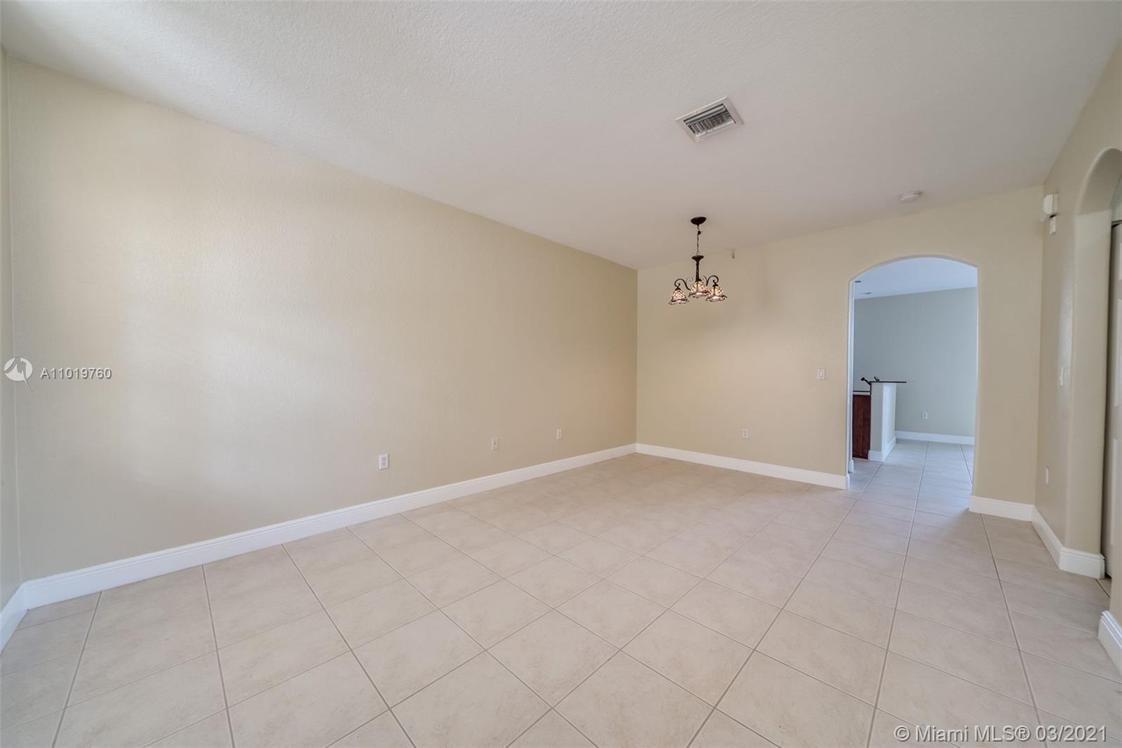 8437 Southwest 29th Street, Unit 102 Miramar, FL 33025 - Photo 5 of 29 wooden floor in an empty room