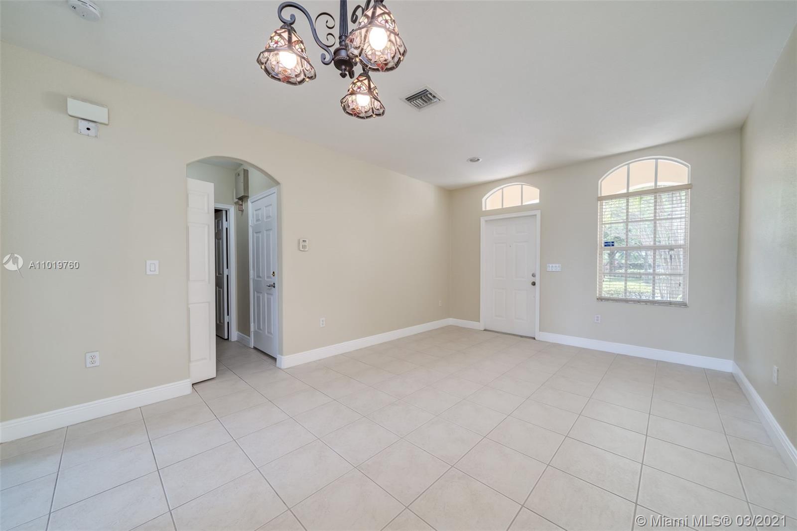 8437 Southwest 29th Street, Unit 102 Miramar, FL 33025 - Photo 7 of 29 a view of an empty room with a window
