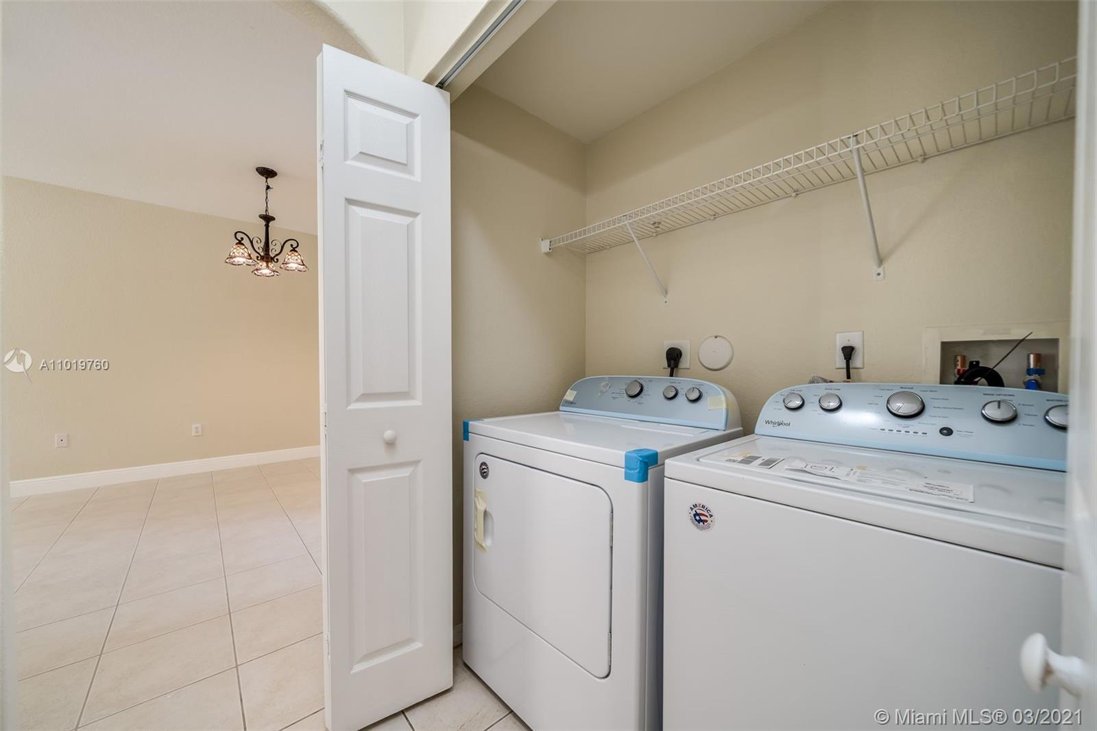 8437 Southwest 29th Street, Unit 102 Miramar, FL 33025 - Photo 8 of 29 a view of storage and utility room with washer and dryer