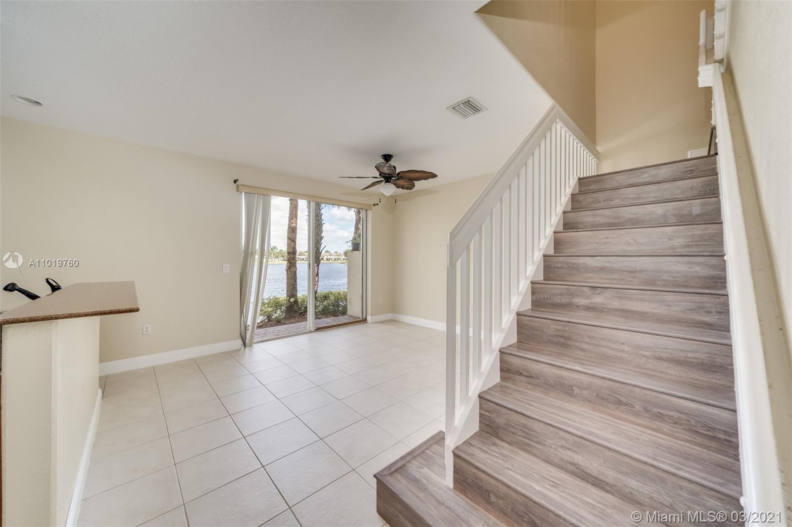 8437 Southwest 29th Street, Unit 102 Miramar, FL 33025 - Photo 10 of 29 a view of entryway and hall with wooden floor