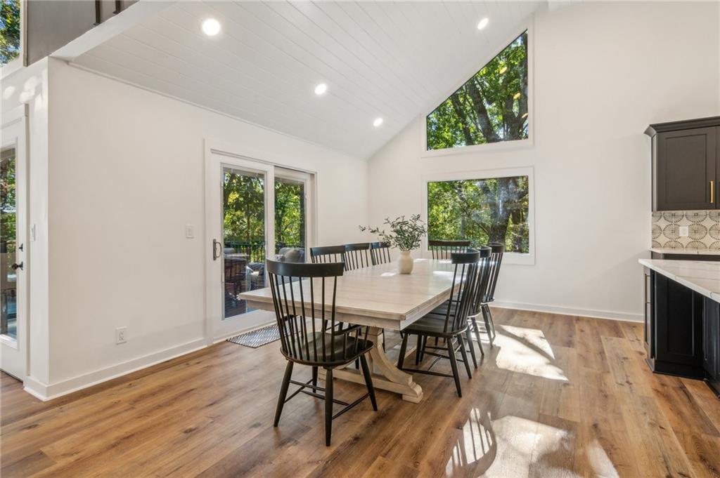 626 Petit Ridge Drive Big Canoe, GA 30143 - Photo 18 of 42 a view of a dining room with furniture window and wooden floor