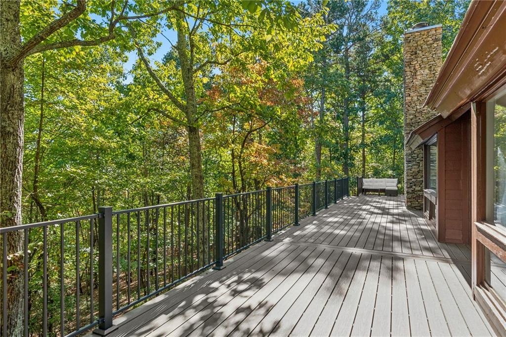 626 Petit Ridge Drive Big Canoe, GA 30143 - Photo 20 of 42 a view of a balcony with wooden floor