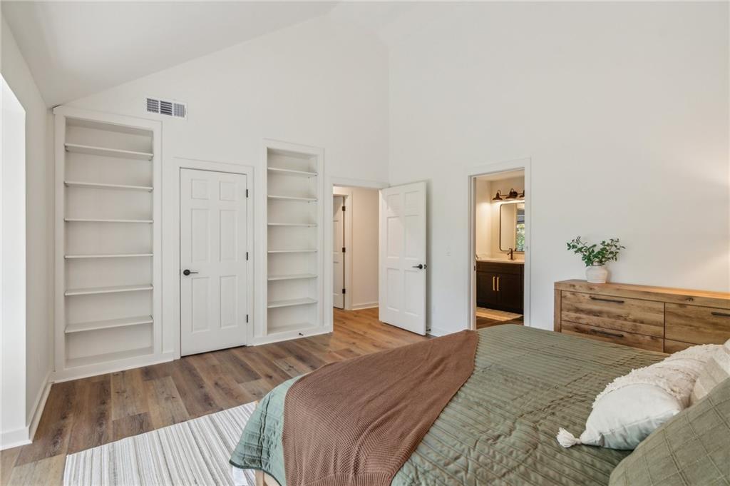 626 Petit Ridge Drive Big Canoe, GA 30143 - Photo 23 of 42 a bedroom with a bed and a dresser