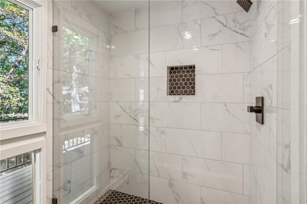626 Petit Ridge Drive Big Canoe, GA 30143 - Photo 25 of 42 a bathroom with a shower