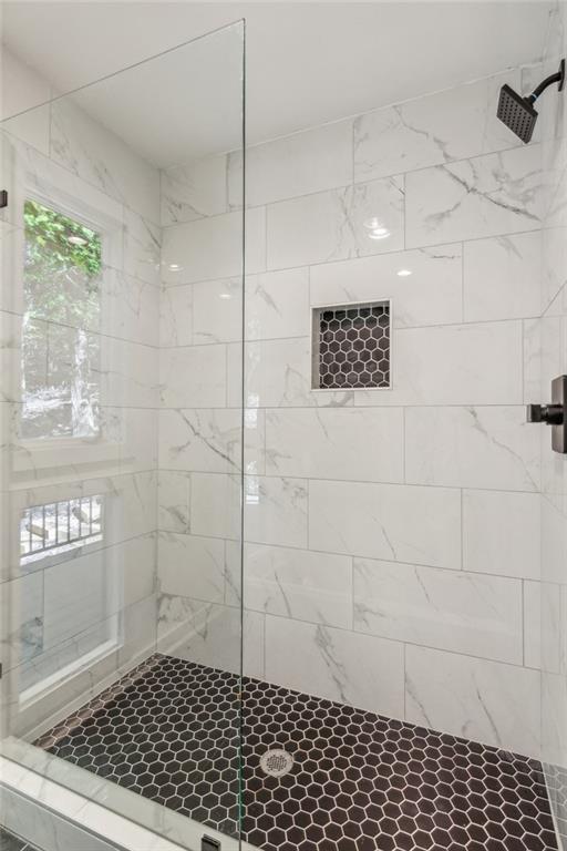 626 Petit Ridge Drive Big Canoe, GA 30143 - Photo 26 of 42 a bathroom with a shower