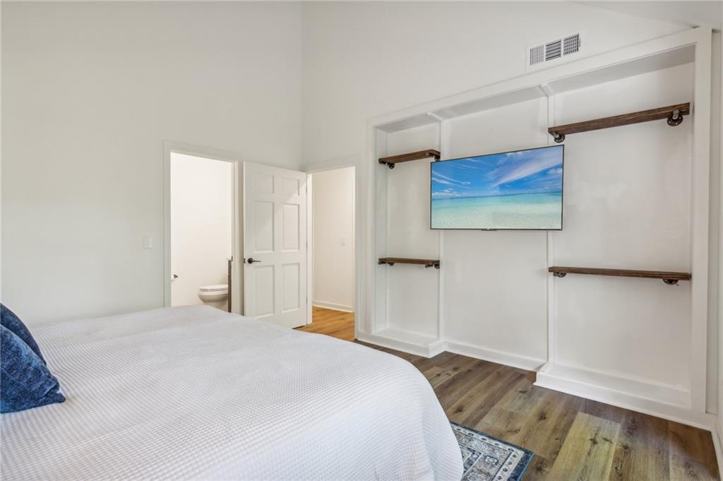 626 Petit Ridge Drive Big Canoe, GA 30143 - Photo 28 of 42 a bedroom with a bed and a painting on the wall