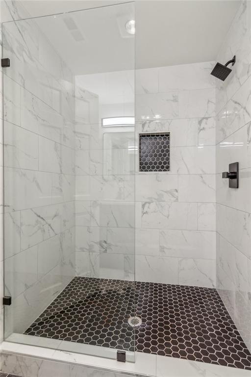 626 Petit Ridge Drive Big Canoe, GA 30143 - Photo 30 of 42 a bathroom with a shower