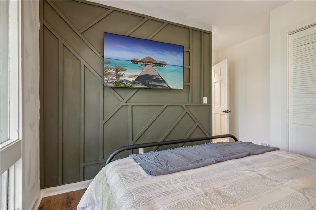 626 Petit Ridge Drive Big Canoe, GA 30143 - Photo 32 of 42 a bedroom with a bed and a painting on the wall