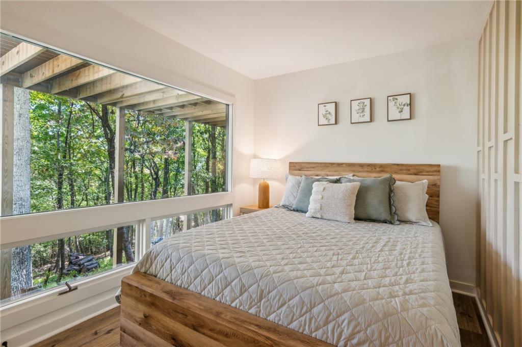 626 Petit Ridge Drive Big Canoe, GA 30143 - Photo 34 of 42 a large bed sitting in a bedroom next to a window