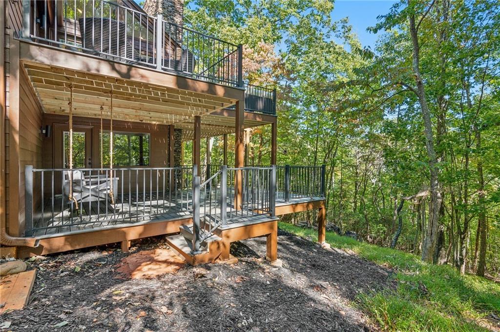 626 Petit Ridge Drive Big Canoe, GA 30143 - Photo 38 of 42 a view of backyard with swimming pool and sitting area