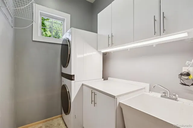a kitchen with kitchen island a stove a sink dishwasher and a refrigerator