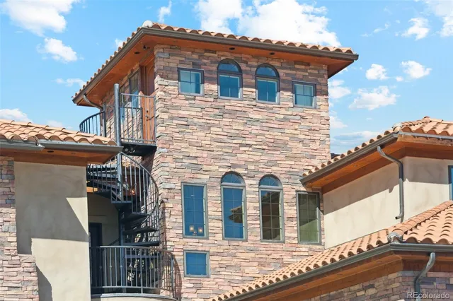 a view of a patio with table and chairs and potted plants