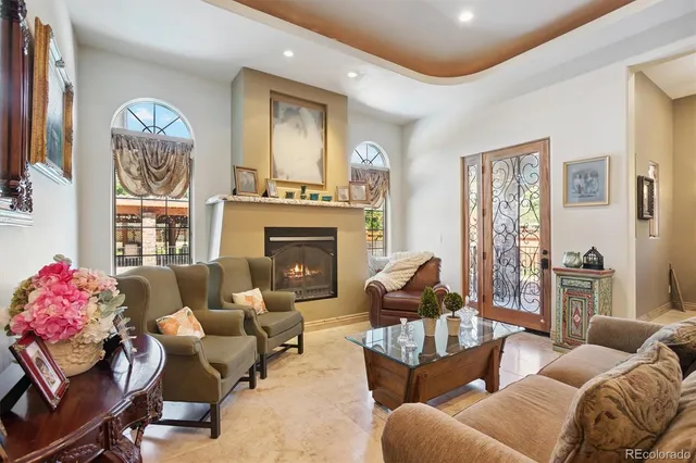 a view of living room filled with furniture and furniture