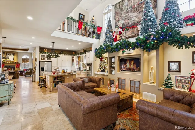 a living room with furniture and a chandelier