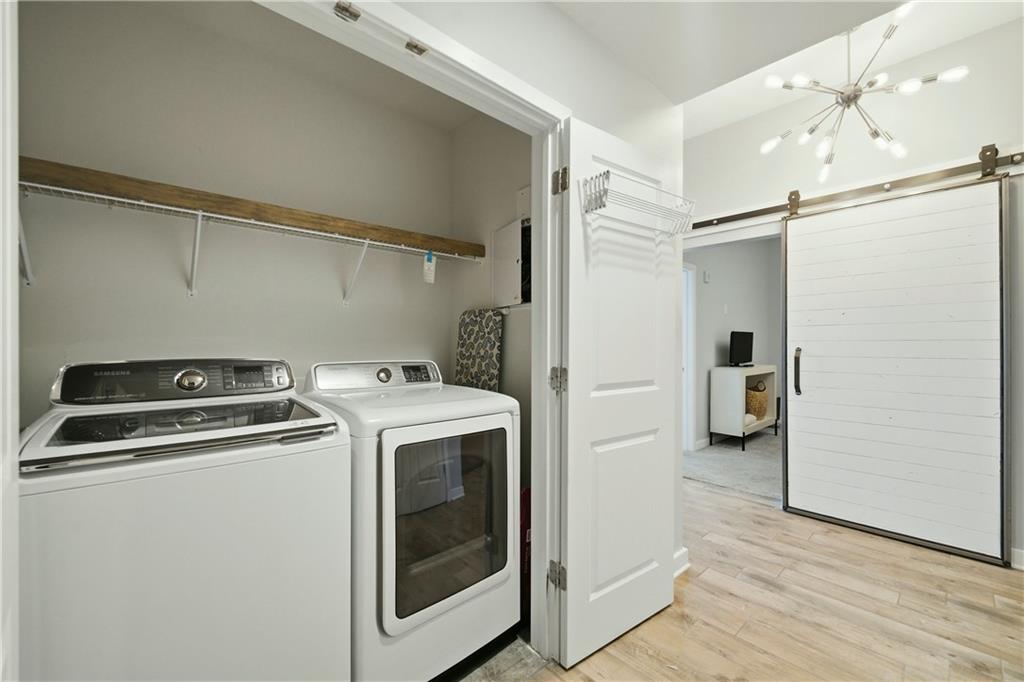 3300 Windy Ridge Parkway Southeast, Unit 1112 Atlanta, GA 30339 - Photo 25 of 43 a view of a storage & utility room with washer and dryer