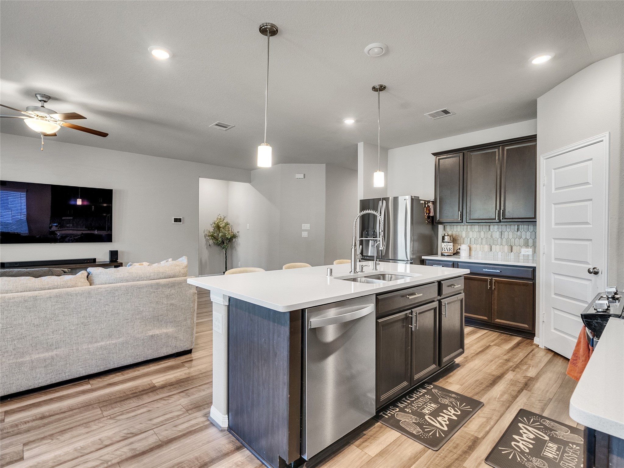 6006 Scott Way Rosenberg, TX 77471 - Photo 12 of 42 a large kitchen with stainless steel appliances kitchen island granite countertop a sink and a stove