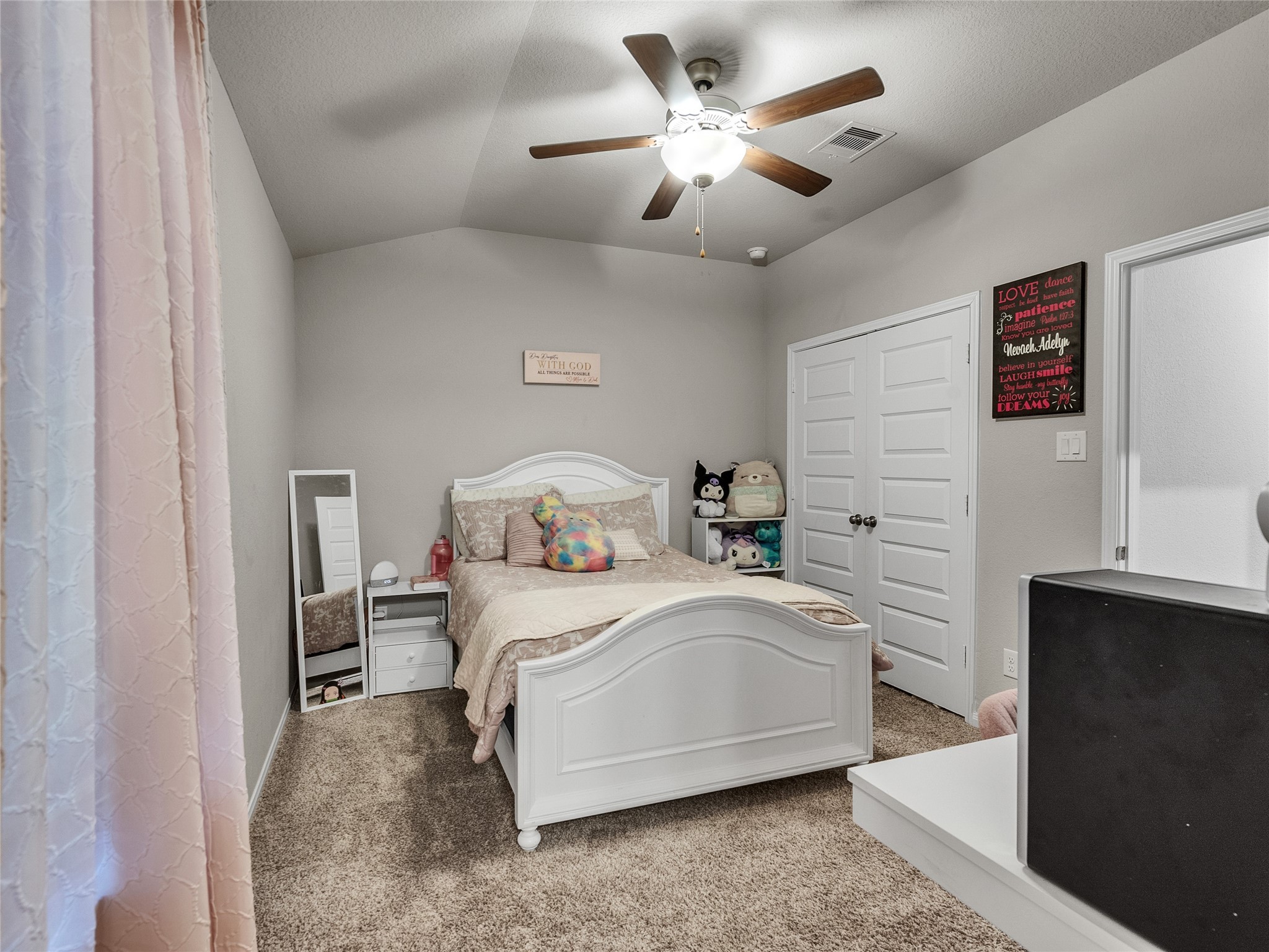 6006 Scott Way Rosenberg, TX 77471 - Photo 22 of 42 a bedroom with a bed and a chandelier