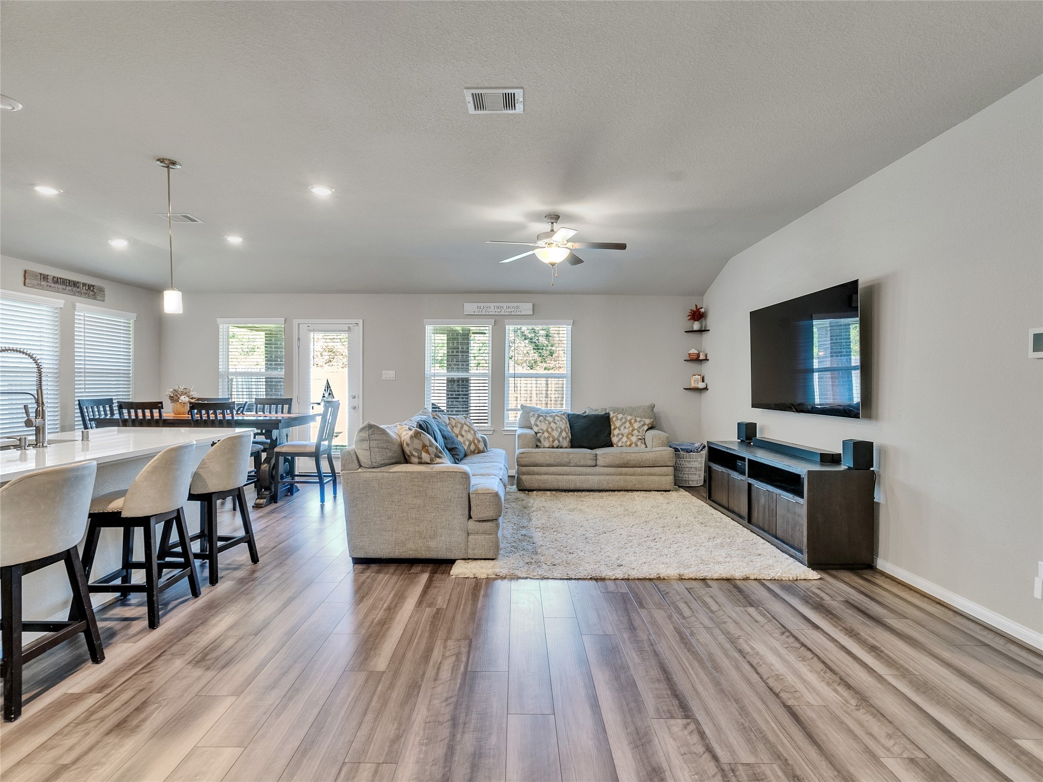 6006 Scott Way Rosenberg, TX 77471 - Photo 3 of 42 a living room with furniture a flat screen tv and wooden floor