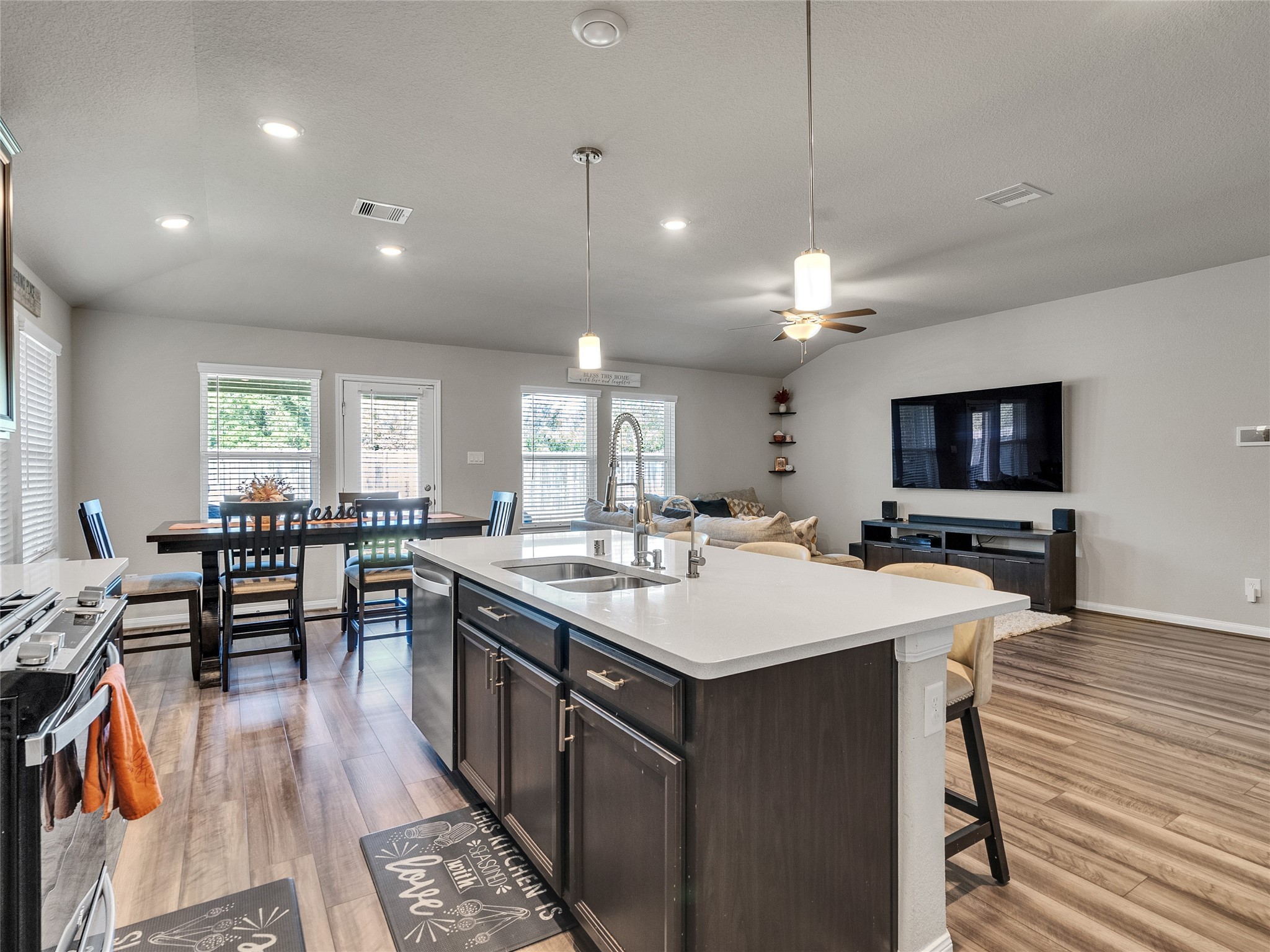 6006 Scott Way Rosenberg, TX 77471 - Photo 9 of 42 a large kitchen with kitchen island a sink table and chairs