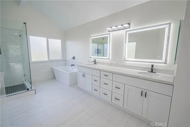 a bathroom with a shower and a sink