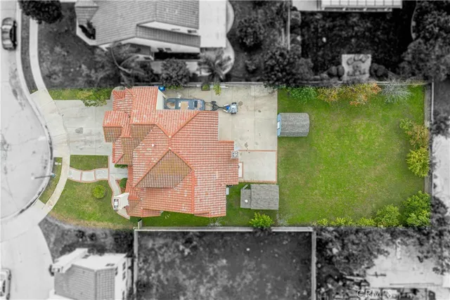 an aerial view of a house with a swimming pool
