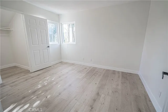 a bathroom with a double vanity sink a mirror and a shower