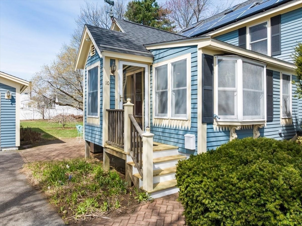 10 2nd Street Natick, MA 01760 - Photo 4 of 31 a front view of a house with a yard