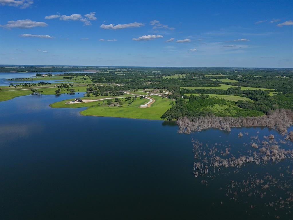 437 Harborside Terrace Windom, TX 75492 - Photo 13 of 28 a view of an ocean and a yard