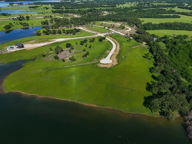 a view of a golf course with a lake