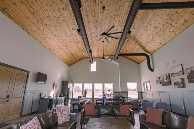 a living room with lots of furniture and a chandelier