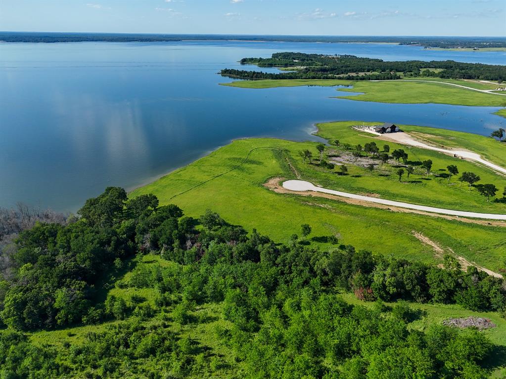 437 Harborside Terrace Windom, TX 75492 - Photo 6 of 28 a view of a water pond with green yard