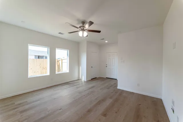 a view of an empty room with a window