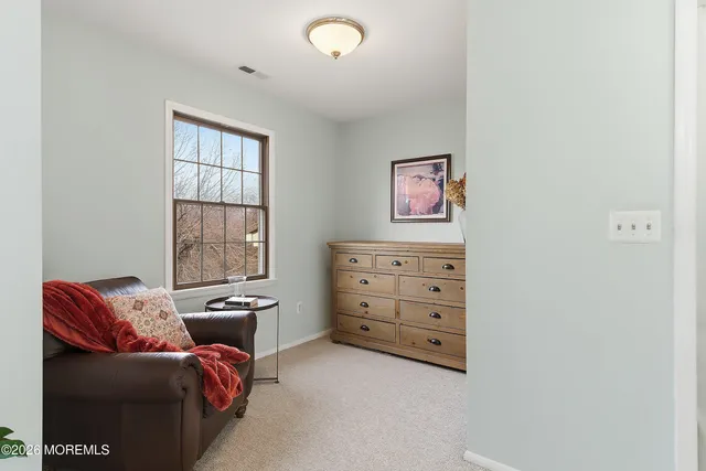 a room with furniture and a window