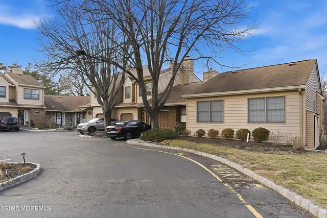 a view of a parked cars in front of a building