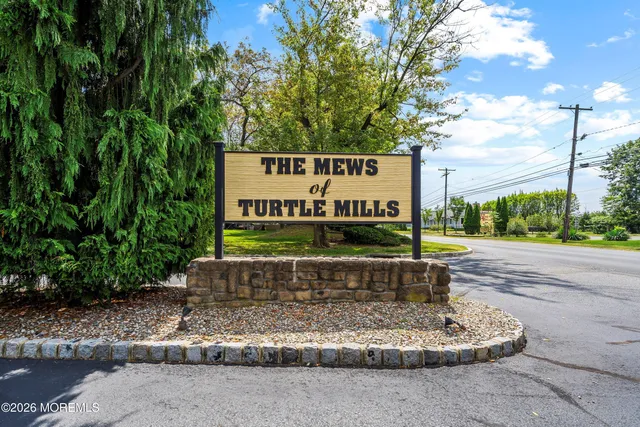 a view of a backyard with sitting area