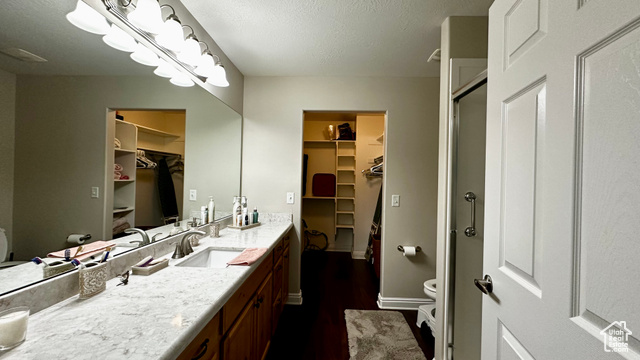 929 West 1920 South, Unit A Syracuse, UT 84075 - Photo 17 of 26 Master bathroom featuring vanity, toilet, and a shower with shower door and walk-in closet
