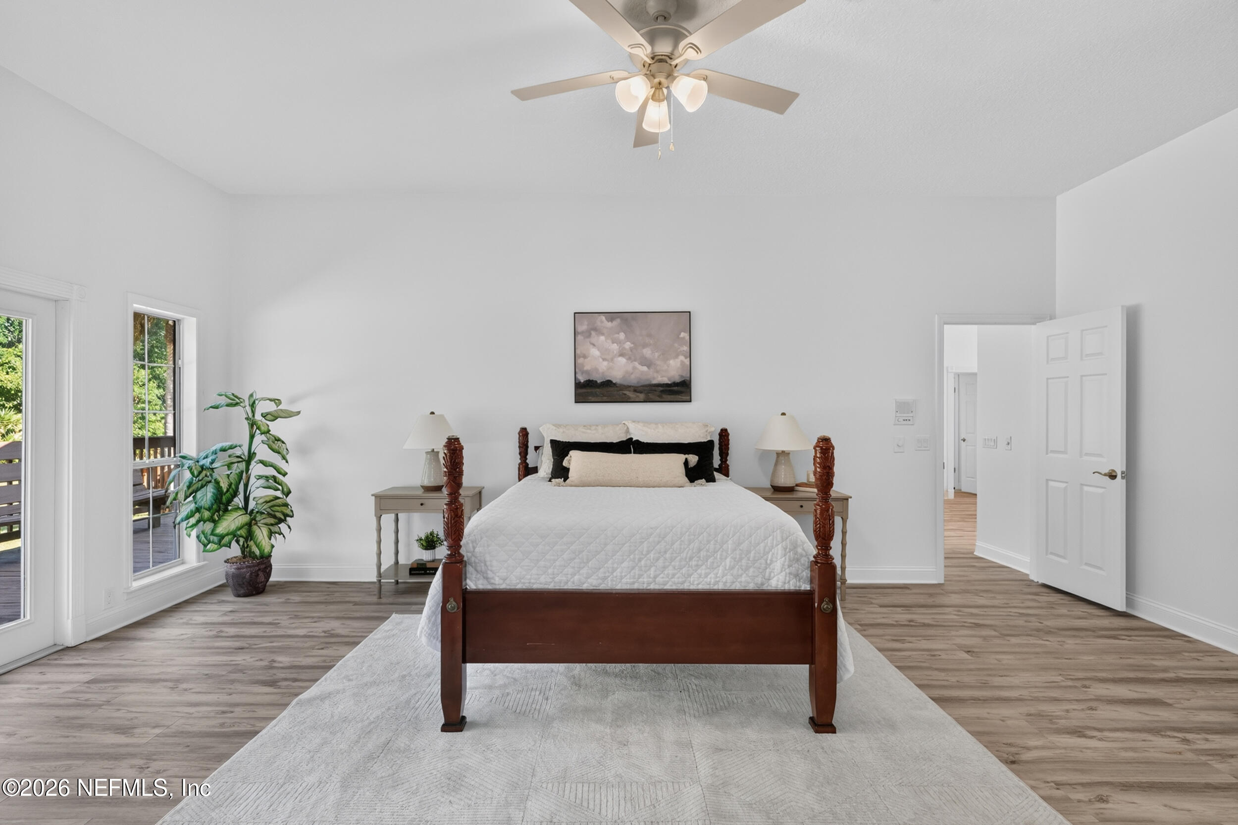 3090 Monument Bay Road St. Augustine, FL 32092 - Photo 22 of 56 a bed sitting in a bedroom and chandelier