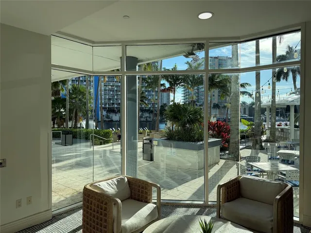 a swimming pool with outdoor seating and yard