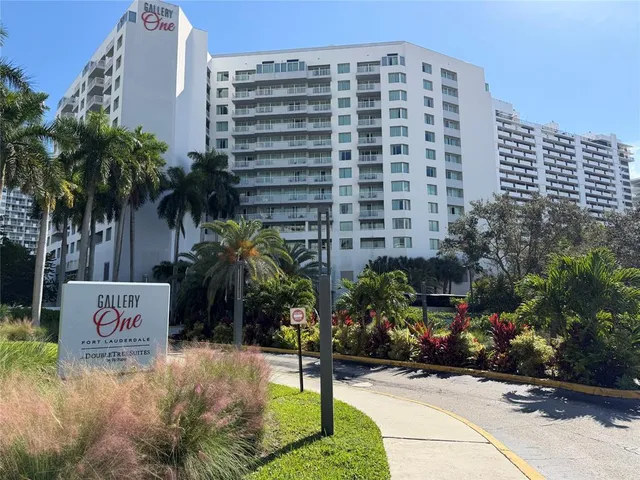 a living room with lots of furniture and white walls