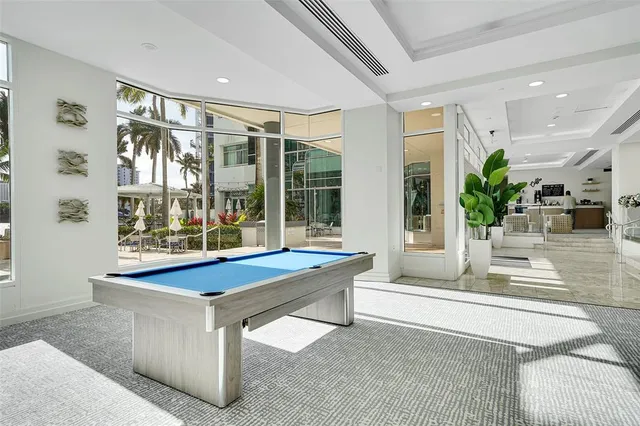 a large kitchen with a table and chairs