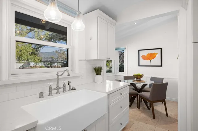 a bathroom with a sink and a window