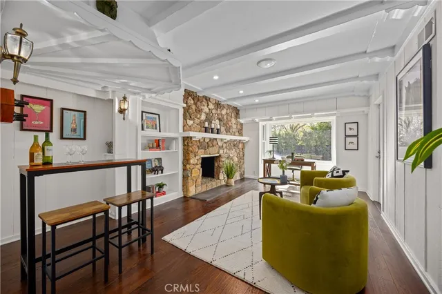 a living room with furniture fireplace and a flat screen tv