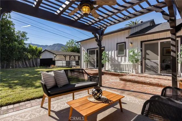 a outdoor living space with furniture and a fireplace