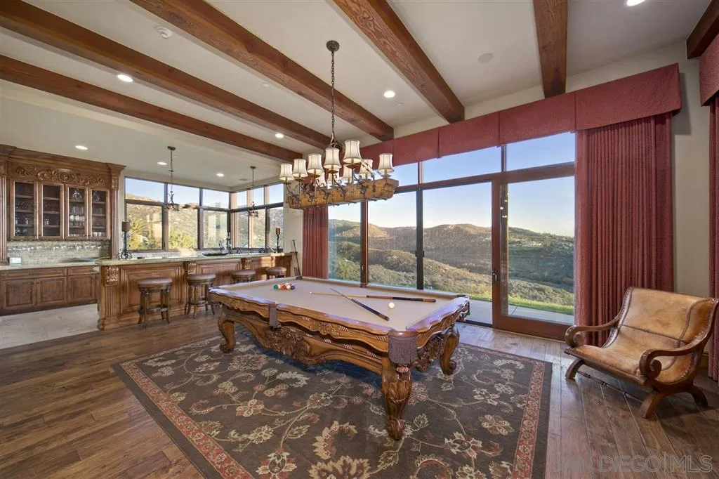 17087 Old Coach Road Poway, CA 92064 - Photo 14 of 25 a room with lots of furniture and a large window