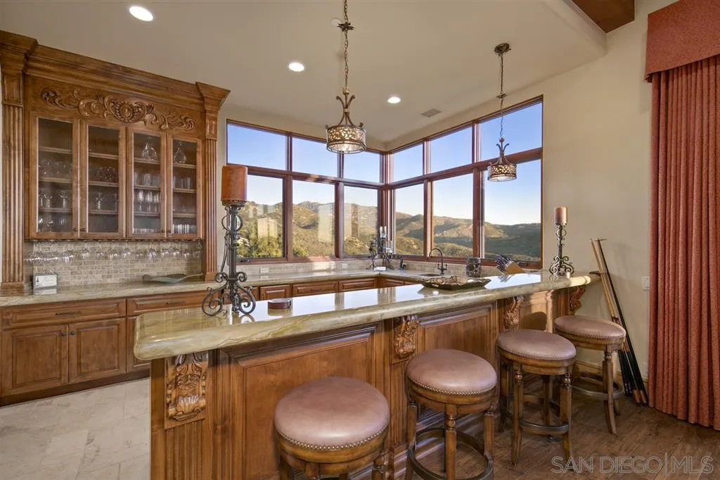 17087 Old Coach Road Poway, CA 92064 - Photo 15 of 25 a dining room with stainless steel appliances granite countertop a sink and a large window