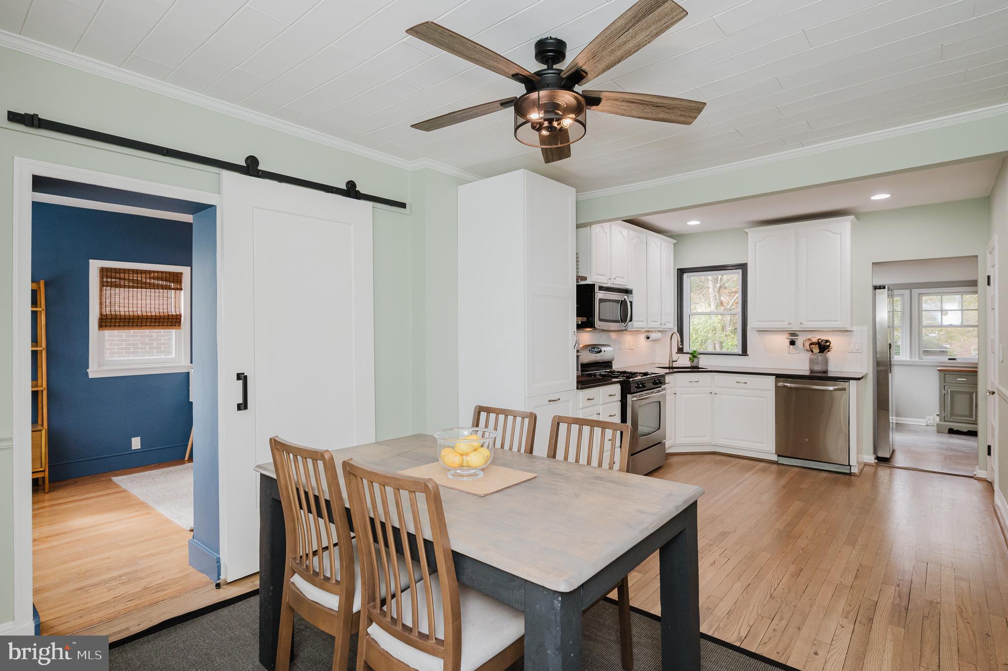 616 Sudbrook Road Baltimore, MD 21208 - Photo 13 of 58 a view of a dining room with furniture and wooden floor